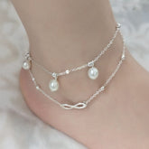 Woman Wearing Double Layer Pearl Anklet - Glöd of Sweden