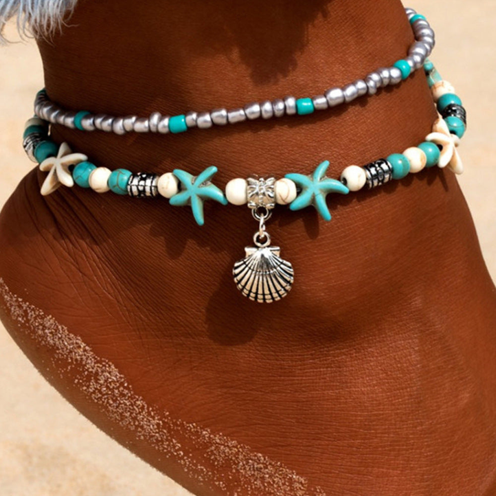 Woman Wearing Beach Anklet with Sea Shell & Starfish Charms - Glöd of Sweden