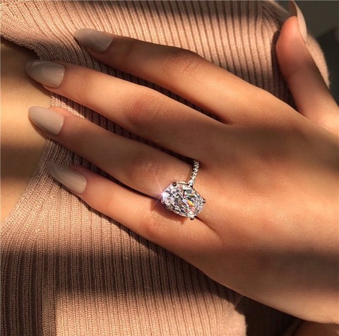 Woman Showing Her Large Oval Platinum Plated Zircon Ring - Glöd of Sweden
