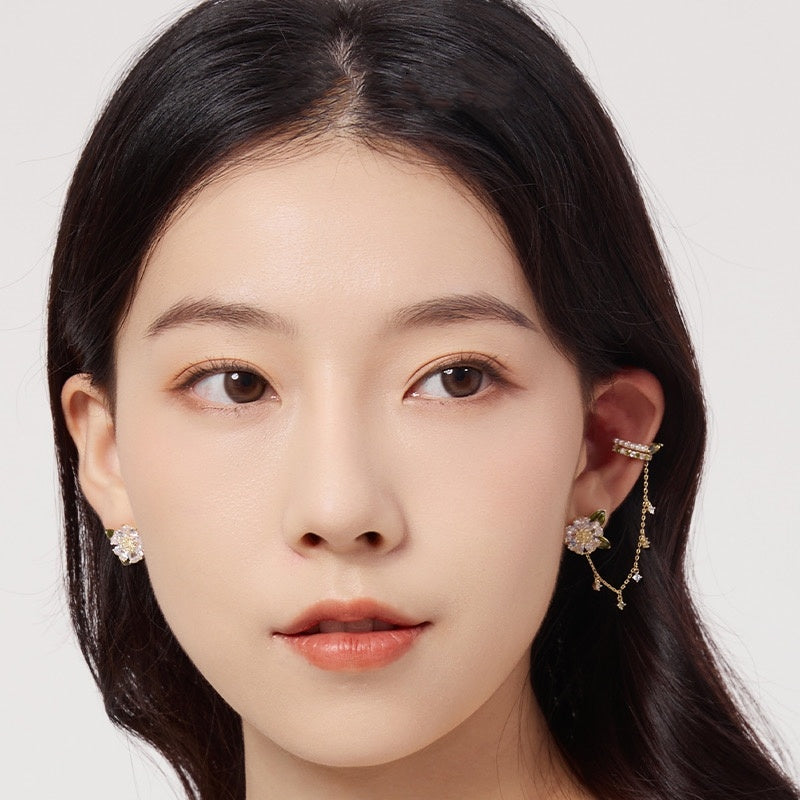 Woman Wearing Asymmetric Long Earrings - Glöd of Sweden