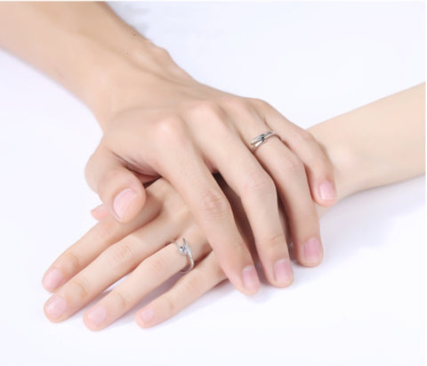 Couple Wearing Adjustable Sterling Silver Cupid Couple Rings - Glöd of Sweden
