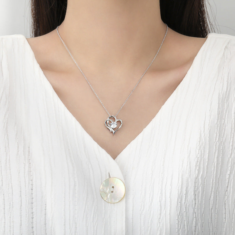 Woman Wearing Elegant Heart Necklace - Glöd of Sweden