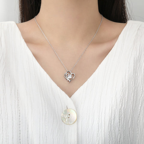 Woman Wearing Elegant Heart Necklace - Glöd of Sweden