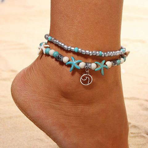 Woman Wearing Beach Anklet with Starfish Charms - Glöd of Sweden