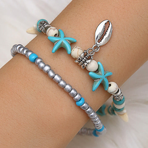 Woman Wearing Beach Anklet with Sea Shell & Starfish Charms - Glöd of Sweden